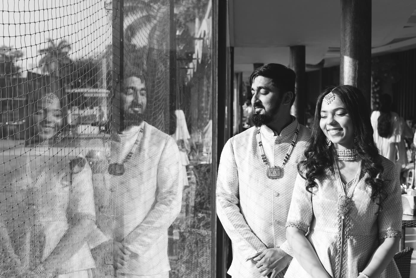 A couple by the window, in black and white
