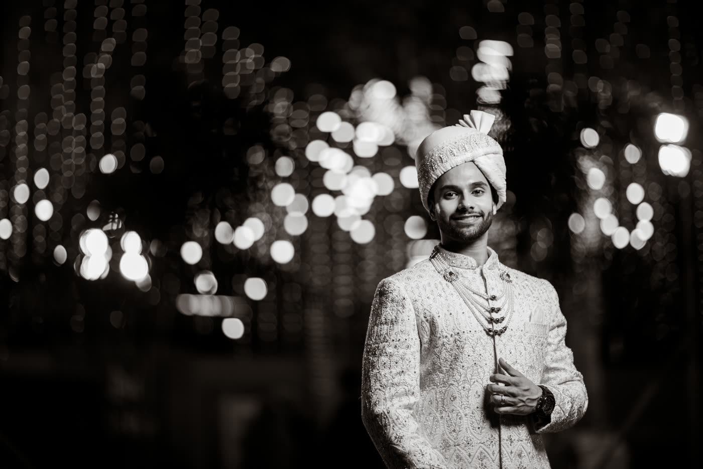 A groom against the night lights