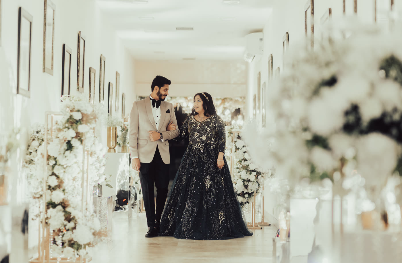 A couple in a bright marble hall